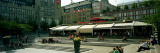 Tourists Sitting in a Park  Kungstradgarden  Stockholm  Sweden