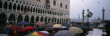 Tourists with Umbrellas on a Town Square  St Mark's Square  Venice  Veneto  Italy