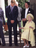 Prince William bends down to talk to The Queen Mother outside Clarence House where she was celebrat