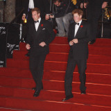 Prince William (left) and his brother Prince Harry arrive for the world premiere of the new James B