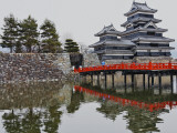 Matsumoto Castle with Moat  Stone Work and Red Wooden Bridge