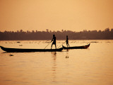 Two Men Poling Canoes on Vembanad Lake