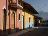 Colourful Houses on Street with Volcán Mombacho in Background