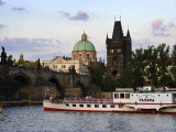 Vltava River with Charles Bridge and Cruise Boat