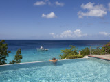 Swimmer in Infinity Pool at Habitat Curacao Dive Resort Near St Willibrordus