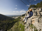 Man Suspended on Flying Fox Watching over Village of Cazorla