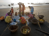 Villagers Looking at Fishing Catch on Beach