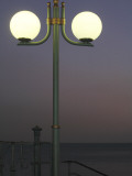 Globe Lamps Overlooking Platja Del Miracle Beach at Dusk