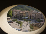 Town Square and Nearby Hills Through Oval Hotel Window