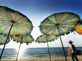 Ice-Cream Seller Walking by Beach Umbrellas  Surin Beach