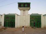 Girl with Traditional Somali Residential Water Storage Tank Above Her