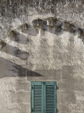 Arch with Shadows and Green Shutters