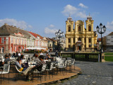 Cafe and Baroque Roman Catholic Cathedral of St George on Piata Unirii