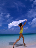 Woman Running on Beach with White Sarong Overhead