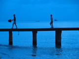 Two Boys Walking on Occidental Grand Cozumel Resort Pier at Sunset