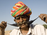 Portrait of Man Holding His Moustache