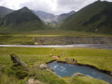 Hiking Group Resting Beside Mineral Spring in Truso Valley