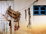 Home-Made Saddle Hanging Outside on Ropes