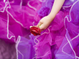 Costumed Girl Holding Rose at Madeira Flower Festival Parade