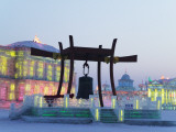 Bronze Bell and Illuminated Ice Sculptures of Traditional Architecture at Ice Festival