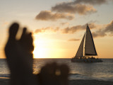Relaxing Feet and Catamaran at Sunset Seen from Bucuti Beach Resort on Eagle Beach