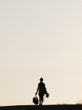 Person Silhouetted Against Sky Walking Back from Bull Jumping Ceremony
