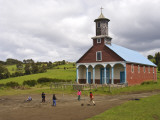 Children Playing Soccer in Front of Iglesia De Putchitco Church