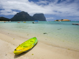 Canoe on Lagoon Beach with Mount Lidgford and Mount Gower in Background