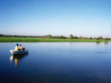 Anglers in Boat Fishing for Barramundi in Yellow Water Wetlands