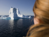 Woman Looking at Iceberg from Ilulissat Kangerlua Icefjord