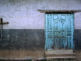 Blue Door and Cross on Wall
