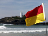 Lifeguards' Warning Flag and Godrevy Lighthouse