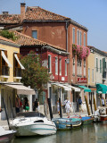 Colourful Houses and Businesses Lining Waterway