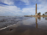 Maspalomas Beach with Maspalomas Lighthouse (Faro De Maspalomas) Reflected in Wet Sand