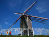 Two Small Girls Looking Up at Sint-Janshuis Windmill