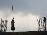 Silhouette of Young Child Holding Prayer Flag