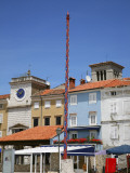 Historical Pole in Frane Petrica Square (Trg Frane Petrica) with City Clock Beyond