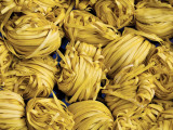 Clusters of Yellow Egg Noodles at Street Side Stall