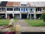 Riding Past French Colonial-Era Shophouses