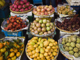 Display of Tropical Fresh Fruit in Market  Including Rambutans  Mangoes  Longans and Dragon Fruit