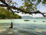 Young Boy on Rope Swing at Tri Trang Beach