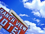 Weather-Beaten Sign of Roadside Hotel