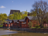 Red-Ochre Painted Shore Houses and Riverside Storage Buildings