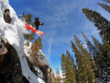 Skier Jumping Off Small Cliff at Brighton Ski Resort