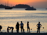 People on Patong Beach Silhouetted at Sunset