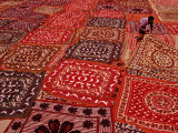 Worker Spreading Out Block Printed Cloth to Dry on River Bank