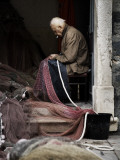 Fisherman Repairing Net
