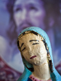 Folk Statue of Our Lady of Guadalupe with Image of Jesus Christ in Background