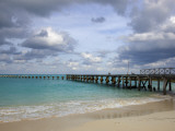 Jetty on Cancun Beach  with Grey Clouds Overhead