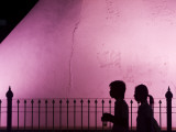 Silhouettes of Pedestrians Against Old City Walls of Khorat City